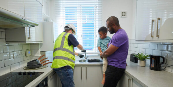 Operative and family in kitchen